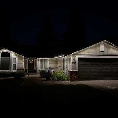 Add beautiful warm white lighting with permanent roofline lighting on your Sierra Foothills home. Photo